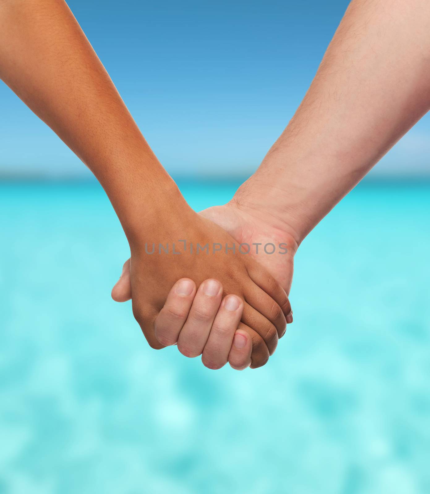 love and relationships concept - closeup of woman and man holding hands