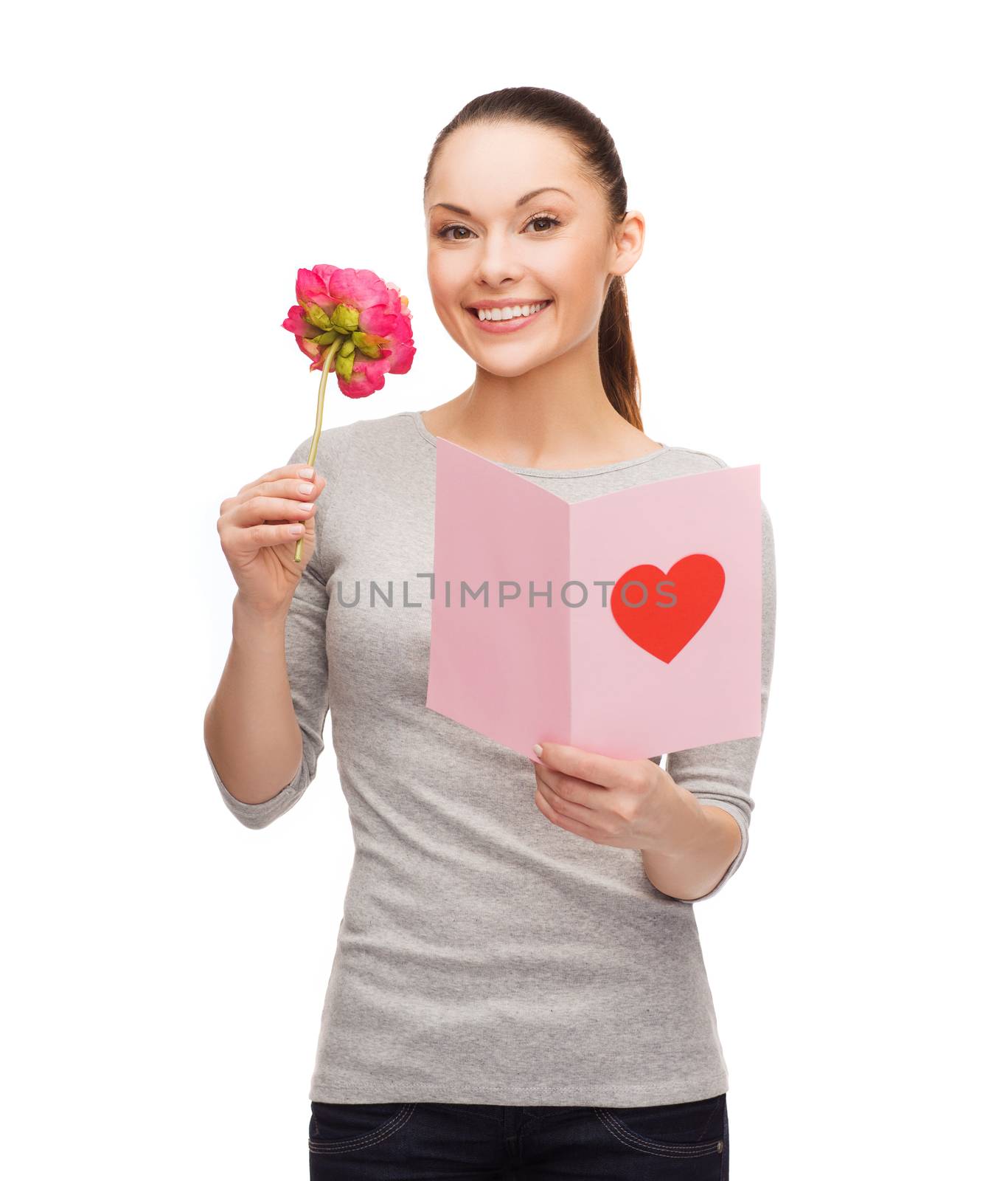 love, holidays and happiness concept - smiling woman with postcard and flower