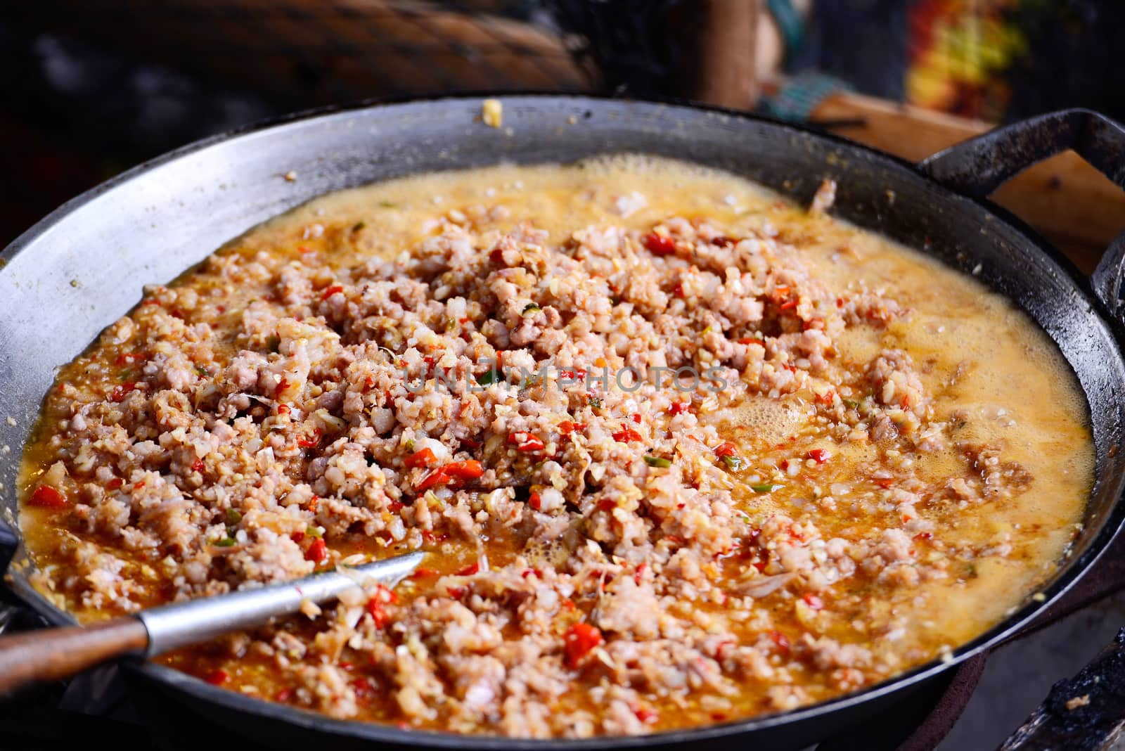 Thai spicy food basil ground pork fried in big pan (Krapao) by Yuri2012