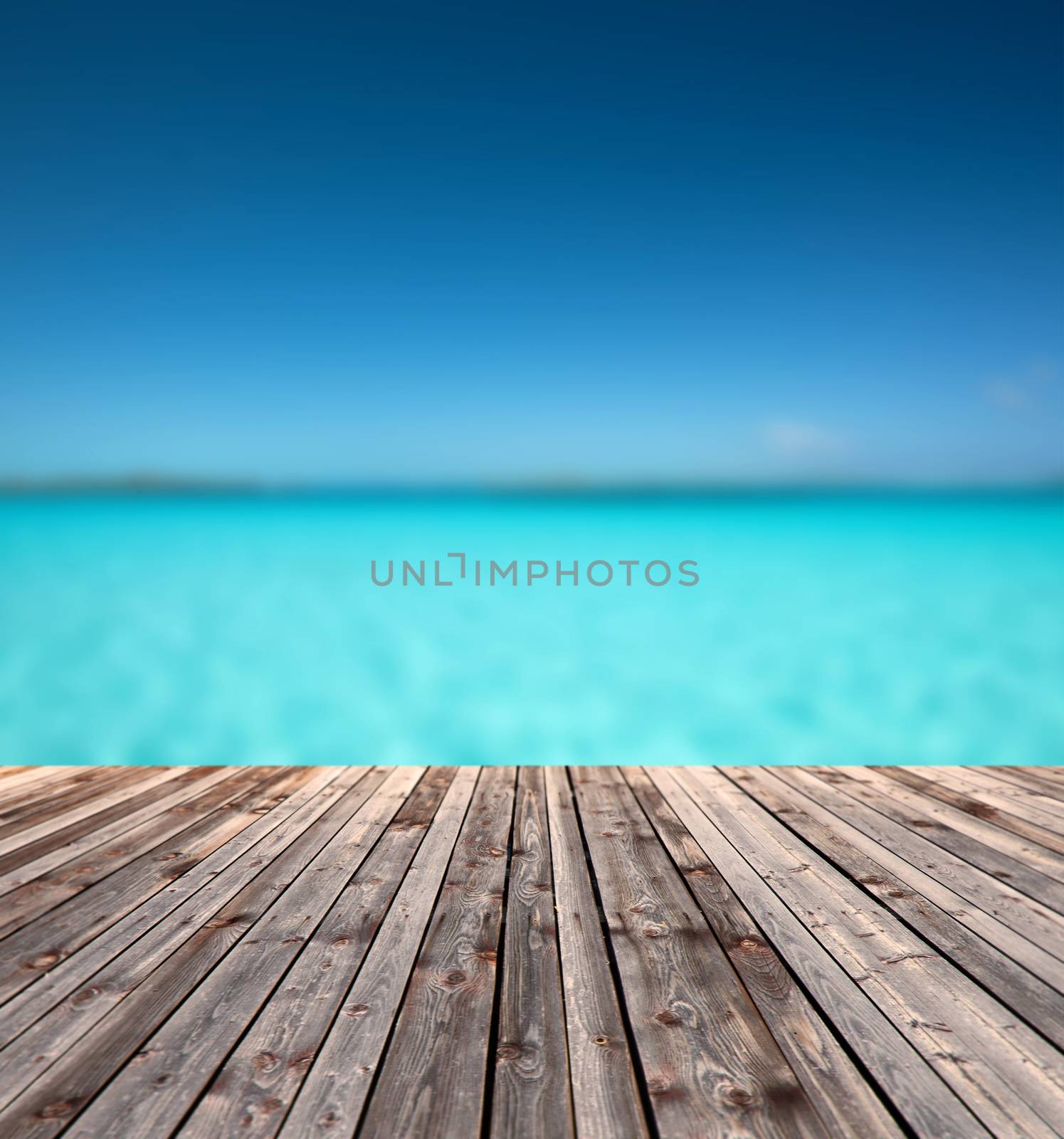 background and texture concept - wooden floor and blue sea