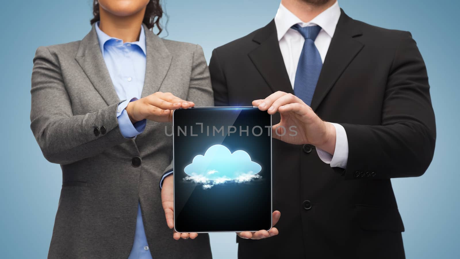 business, technology and internet concept - businessman and businesswoman with cloud on tablet pc screen