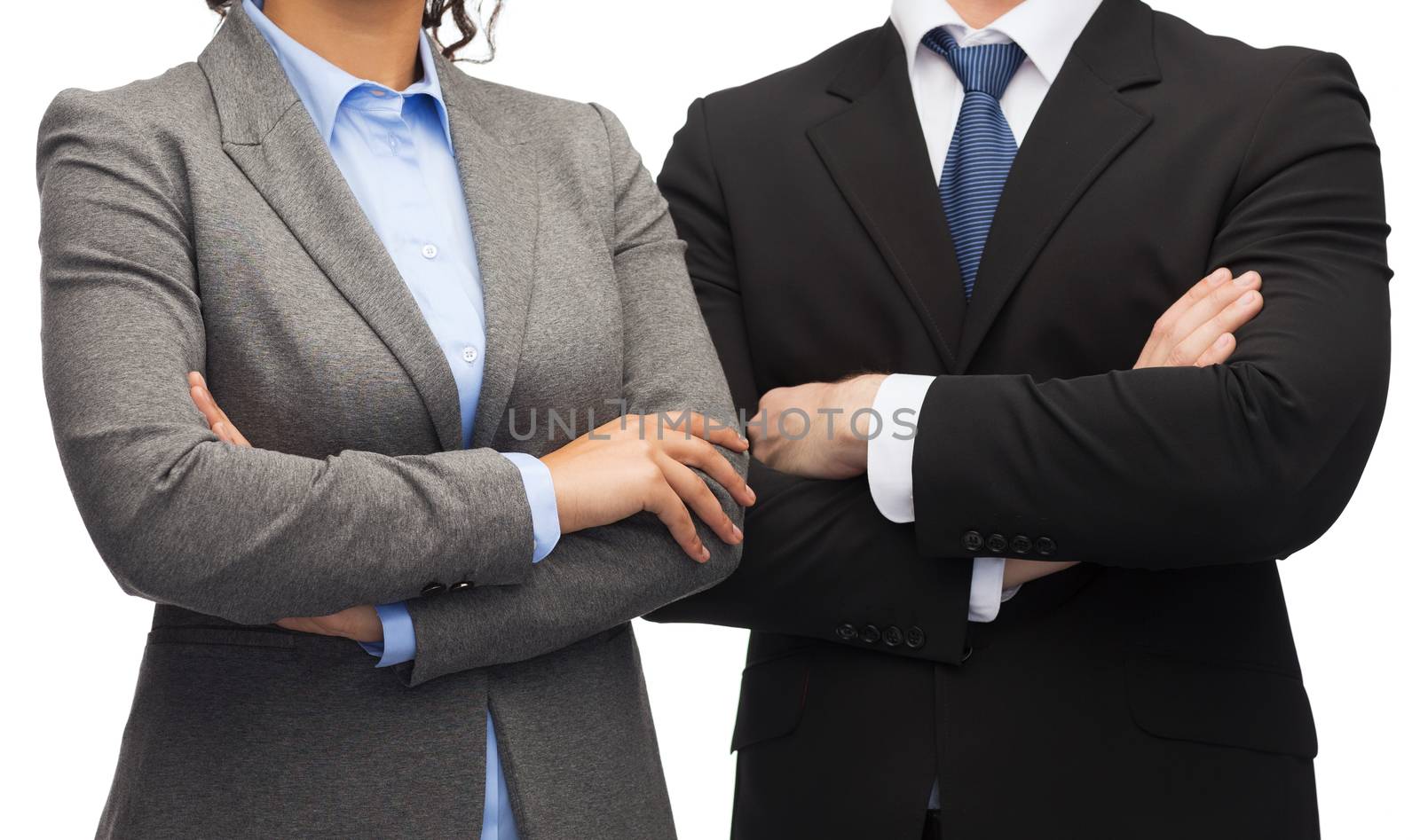 business and education concept - smiling businesswoman and businessman with crossed arms