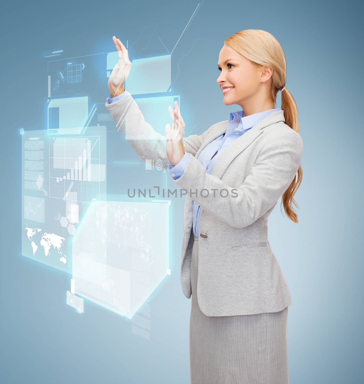smiling businesswoman working with virtual screen by dolgachov
