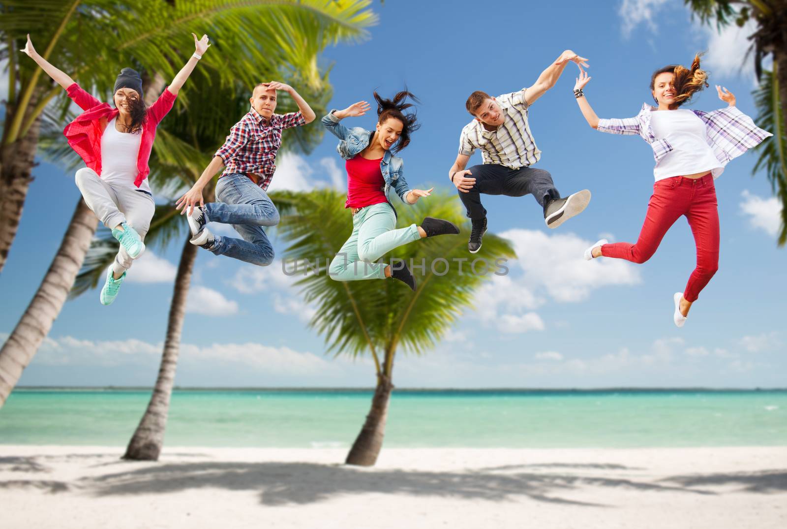 summer, sport, dancing, vacation and teenage lifestyle concept - group of teenagers jumping