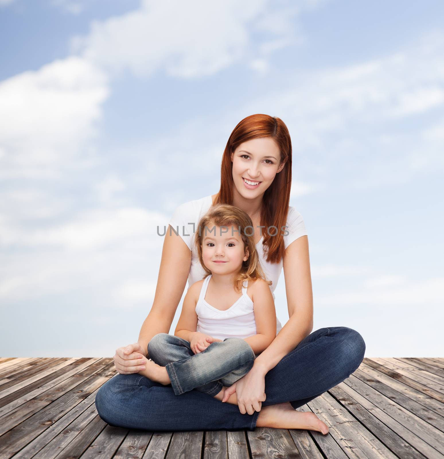 childhood, parenting and relationship concept - happy mother with adorable little girl