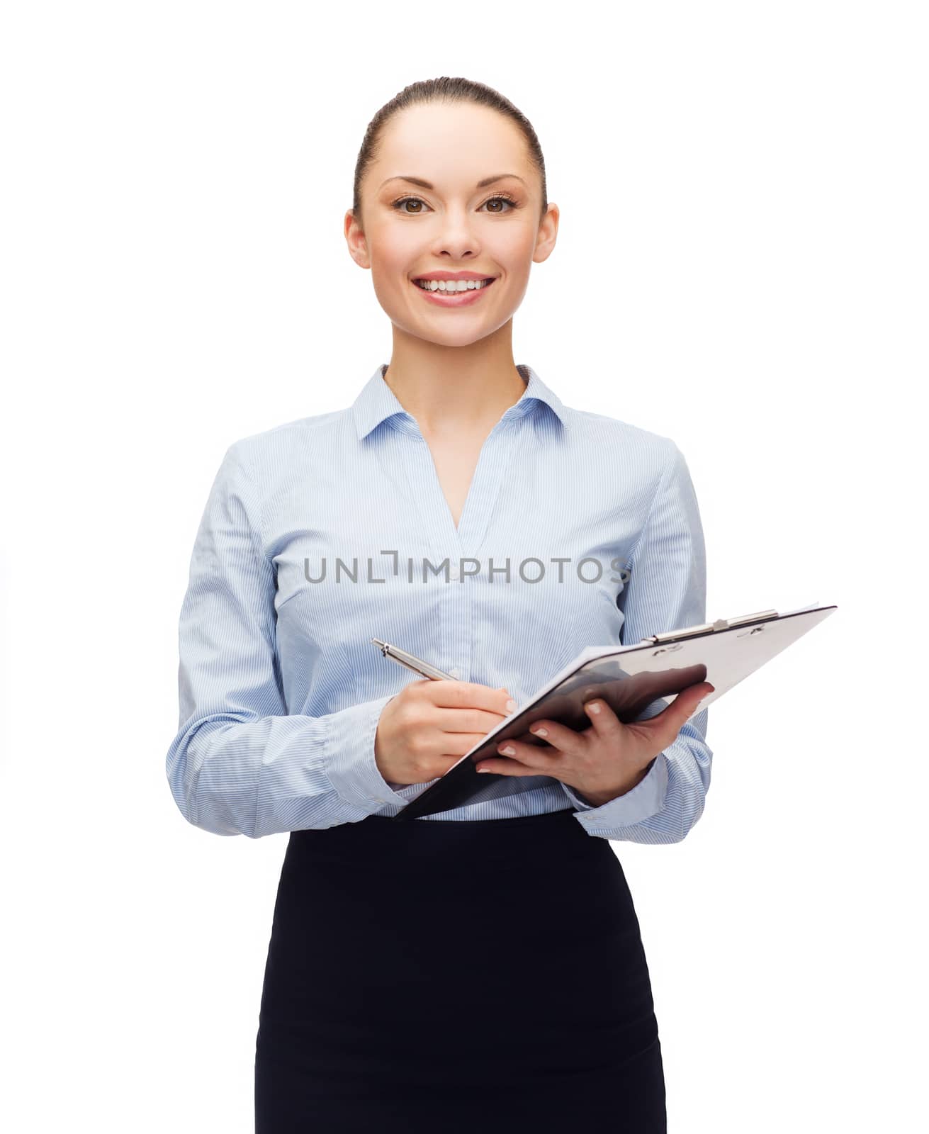 young smiling businesswoman with clipboard and pen by dolgachov