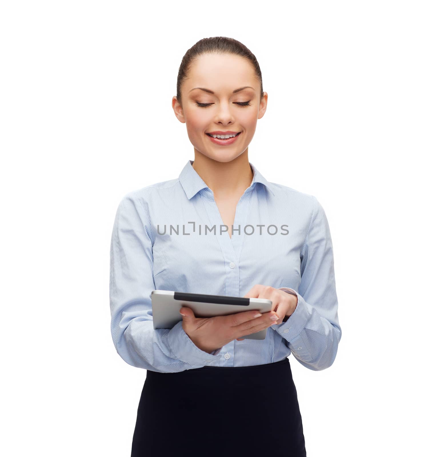 smiling woman looking at tablet pc computer by dolgachov