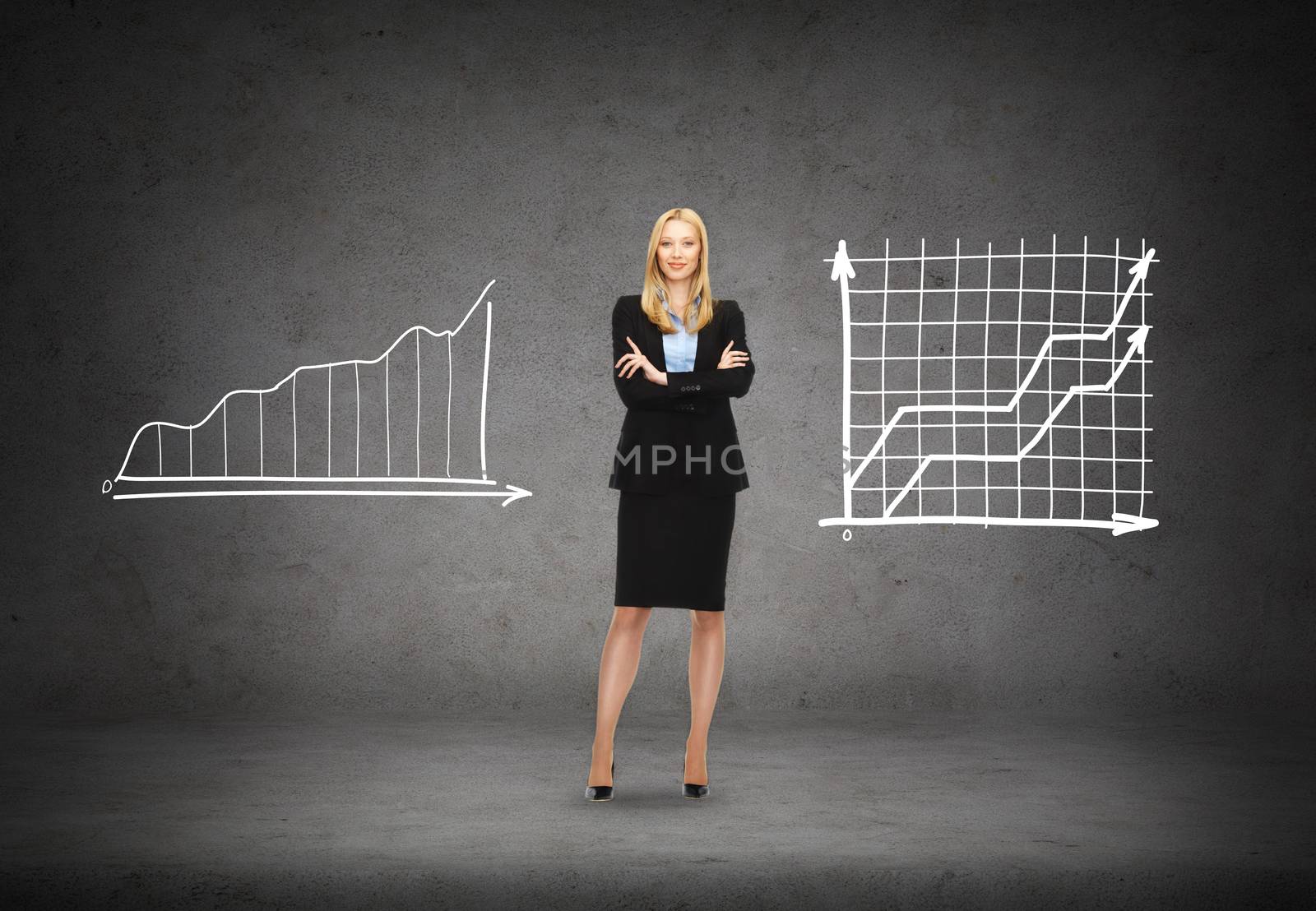 business, communication and office concept - friendly young smiling businesswoman with graphs on the back