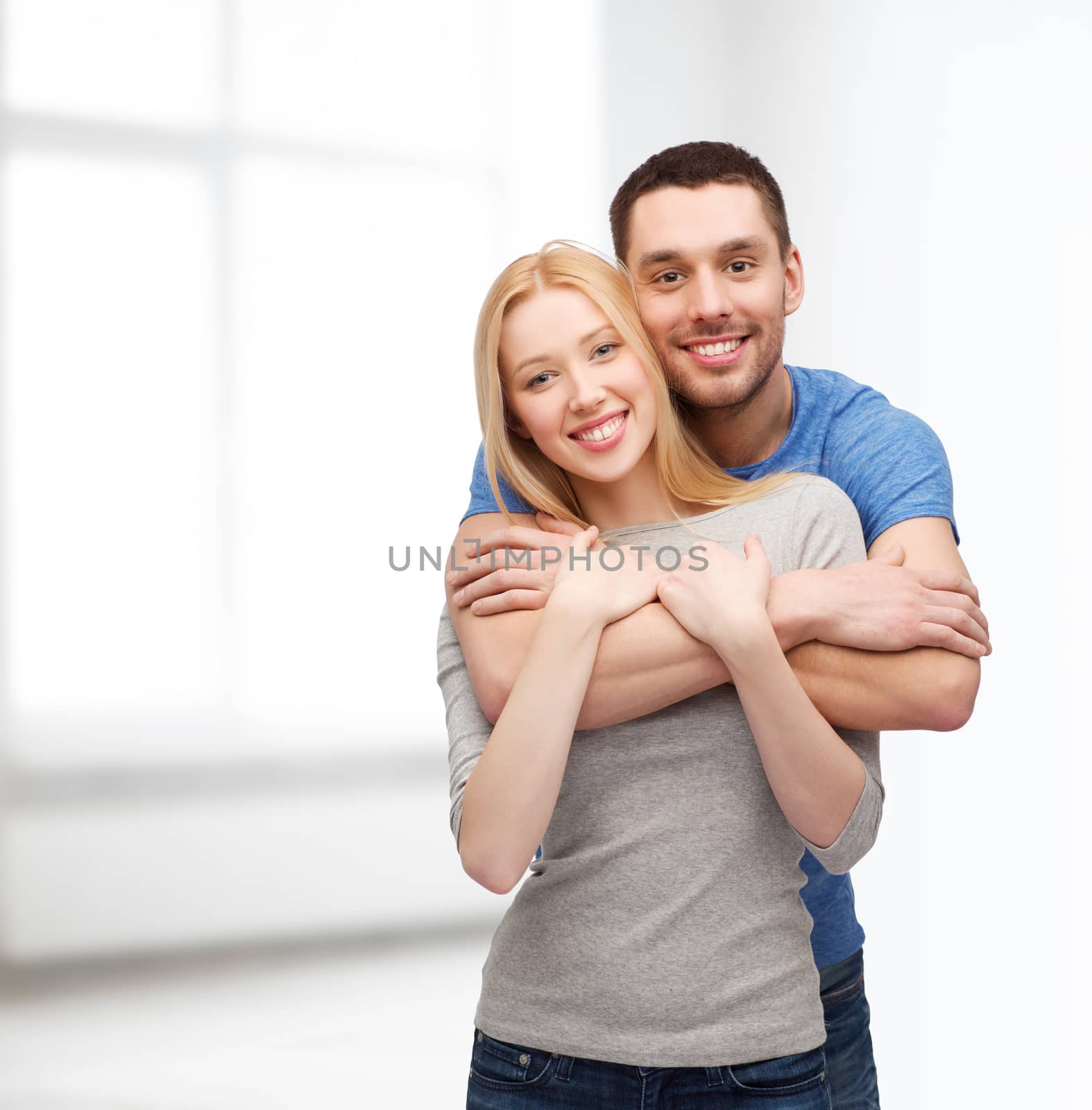 smiling couple hugging by dolgachov