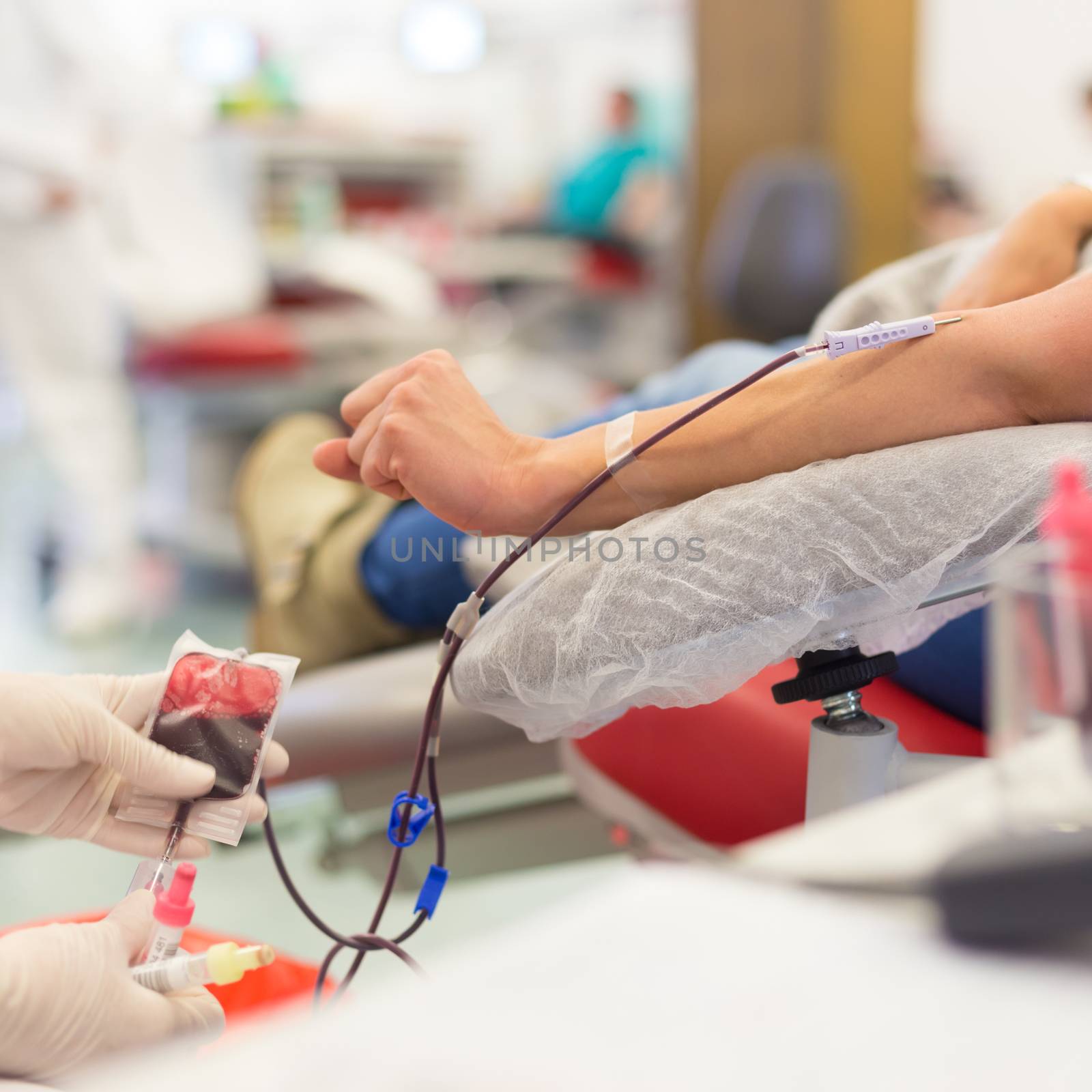 Role of nurses in blood services and donor sessions.  Nurse and blood donor at donation.