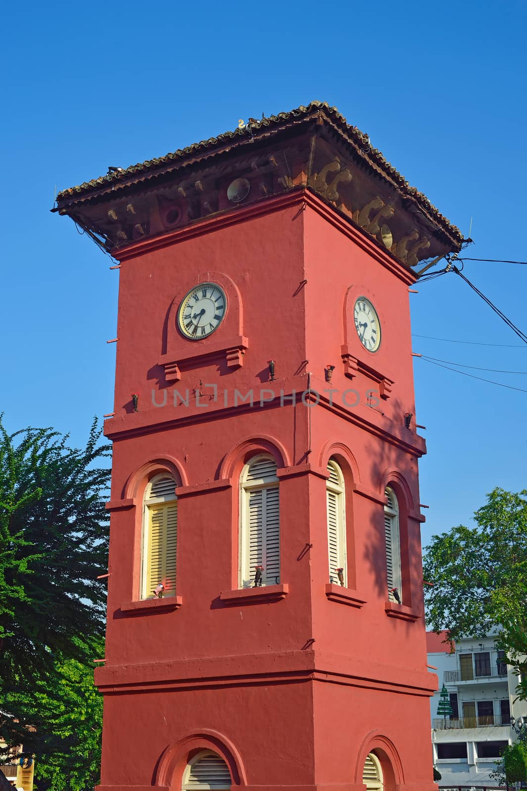 malacca historic old clock tower by think4photop