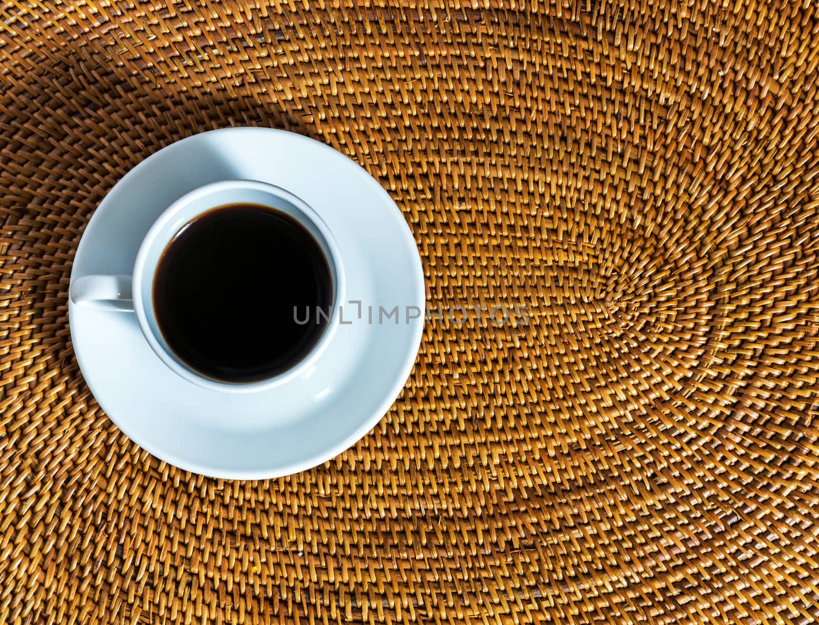 coffee cup on a wicker placemat