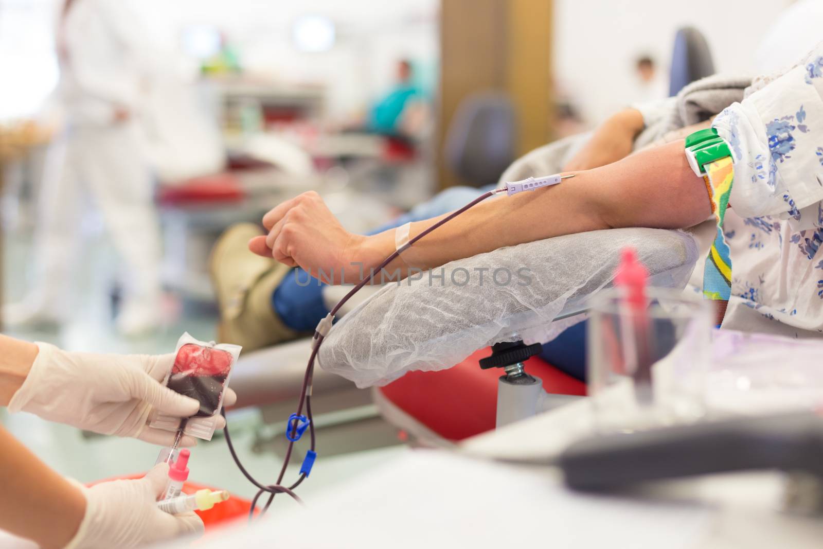 Role of nurses in blood services and donor sessions.  Nurse and blood donor at donation.