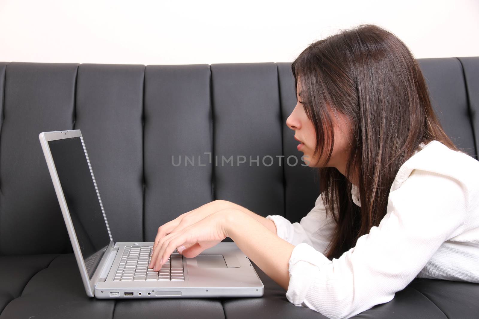 Young Hispanic Woman surfing on the Sofa		 by Spectral