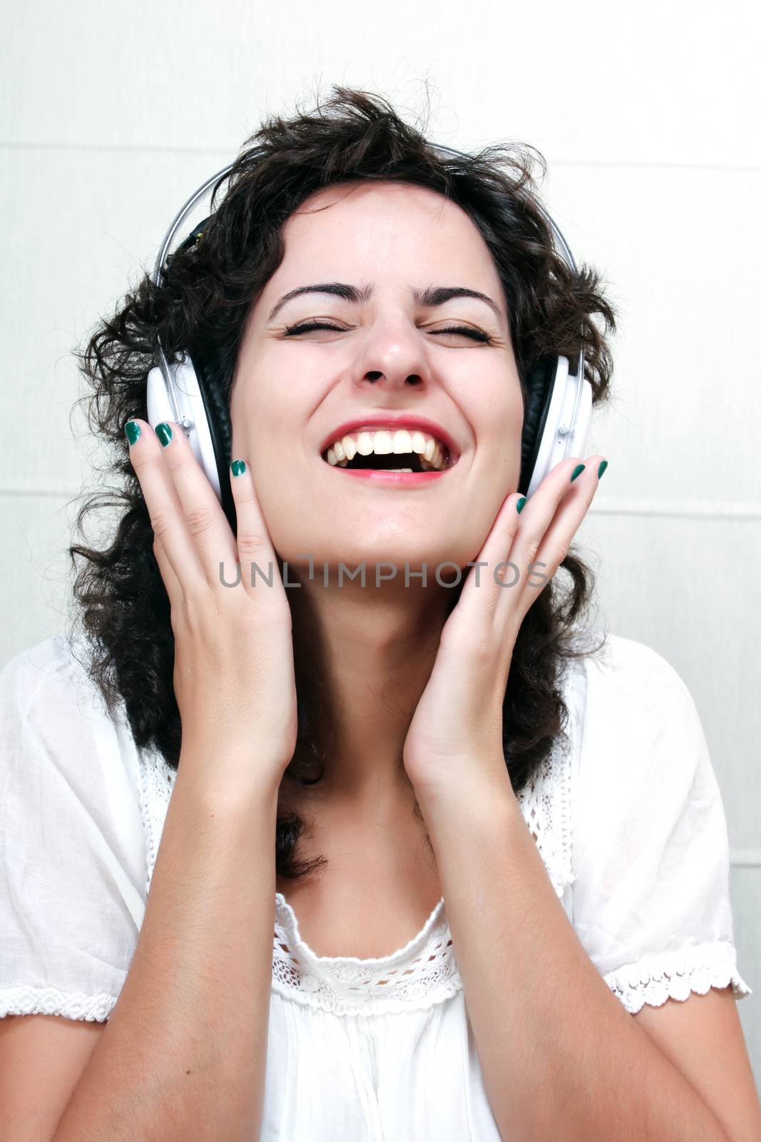 A young woman listening music with Headphones.