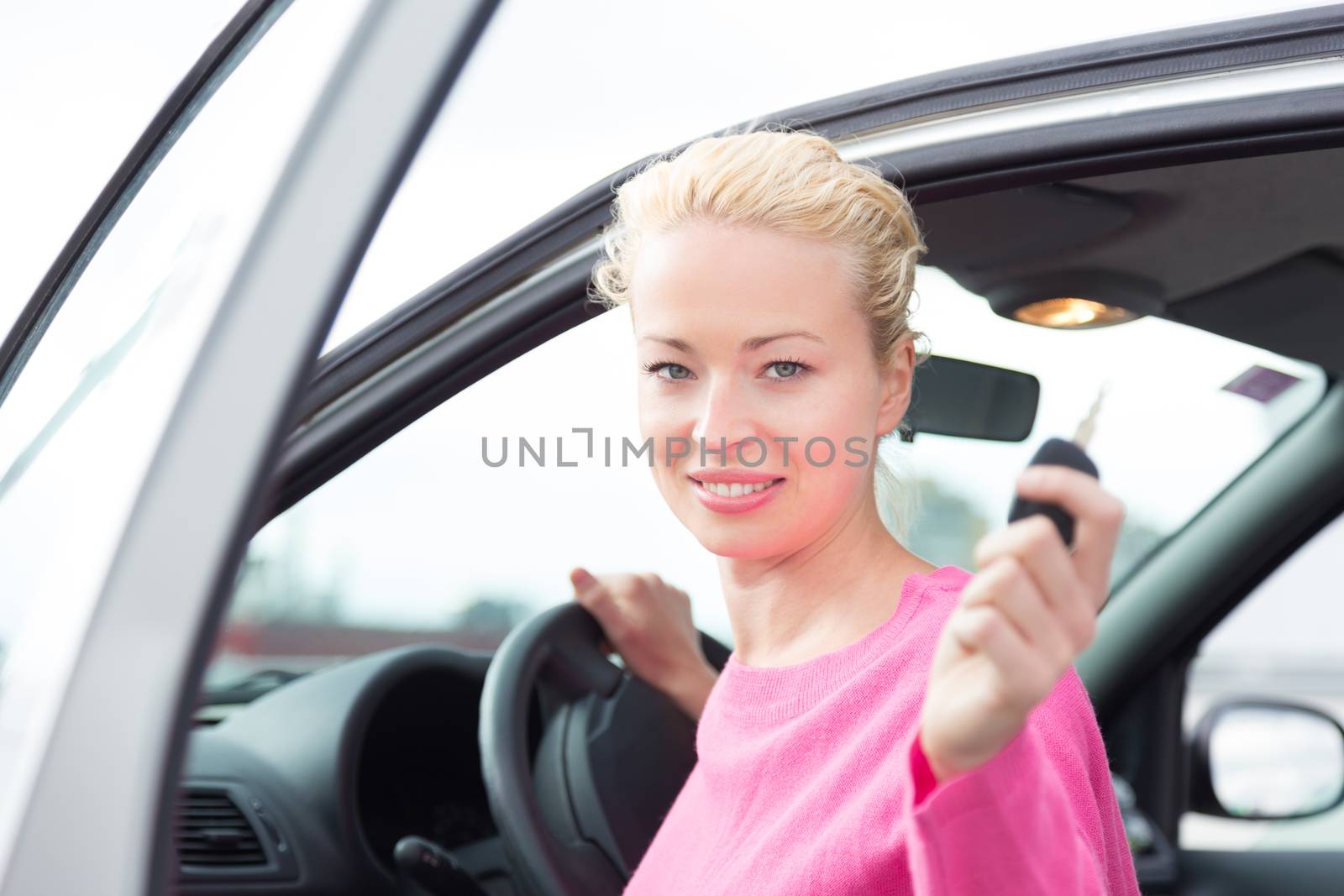 Woman driver showing car keys. by kasto