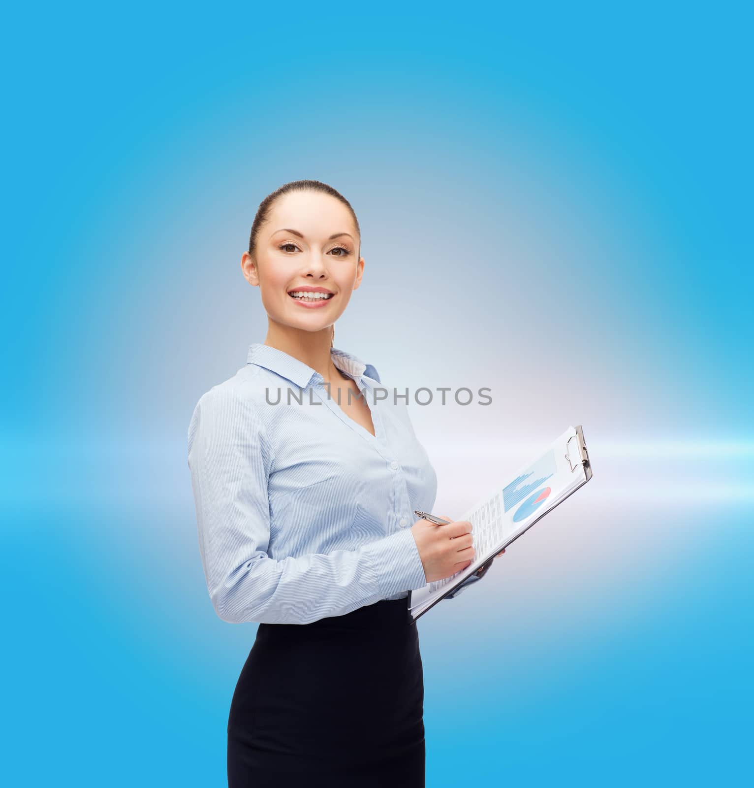 young smiling businesswoman with clipboard and pen by dolgachov