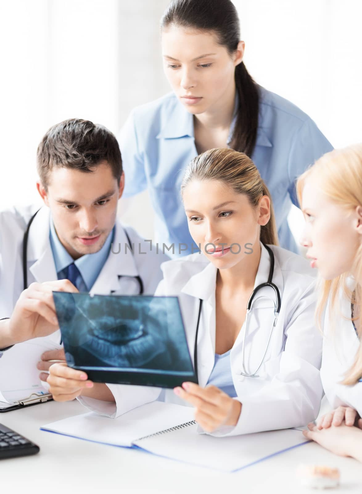 picture of young group of doctors looking at x-ray