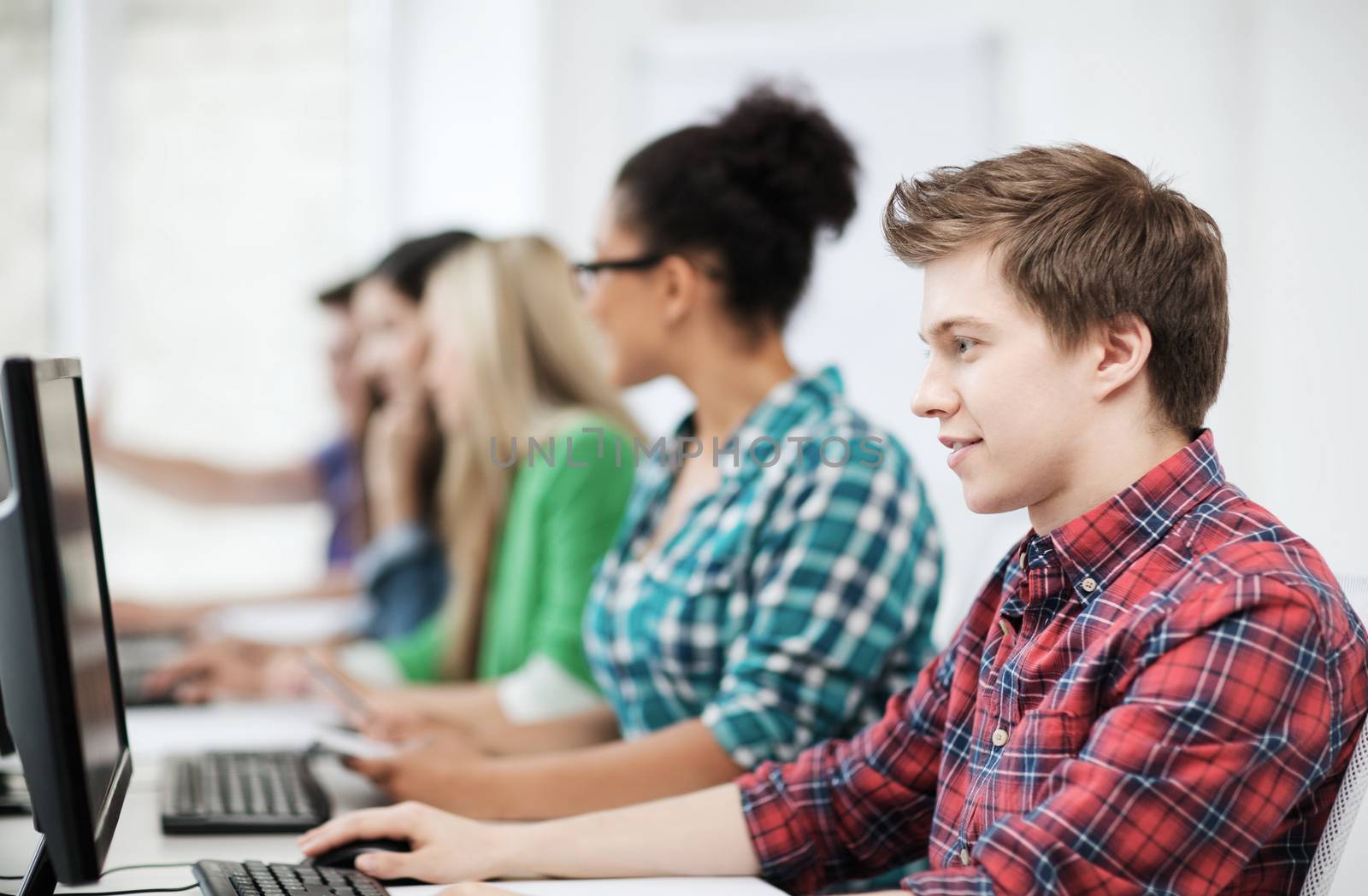 education concept - student with computer studying at school