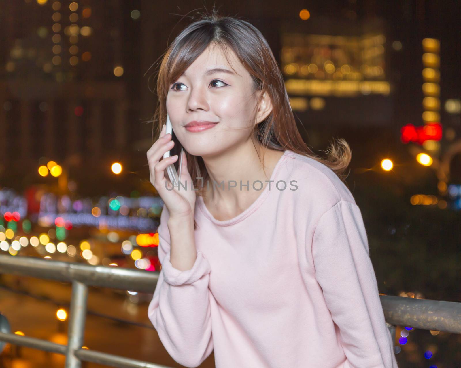 Attractive Malaysian Woman Talking on Phone