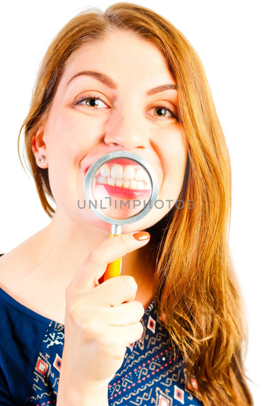 girl with magnifier showing his beautiful white teeth by kosmsos111