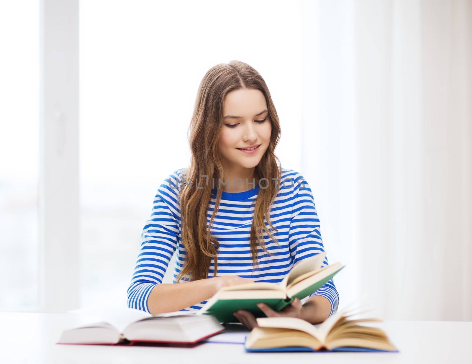 education and home concept - happy smiling student girl with books