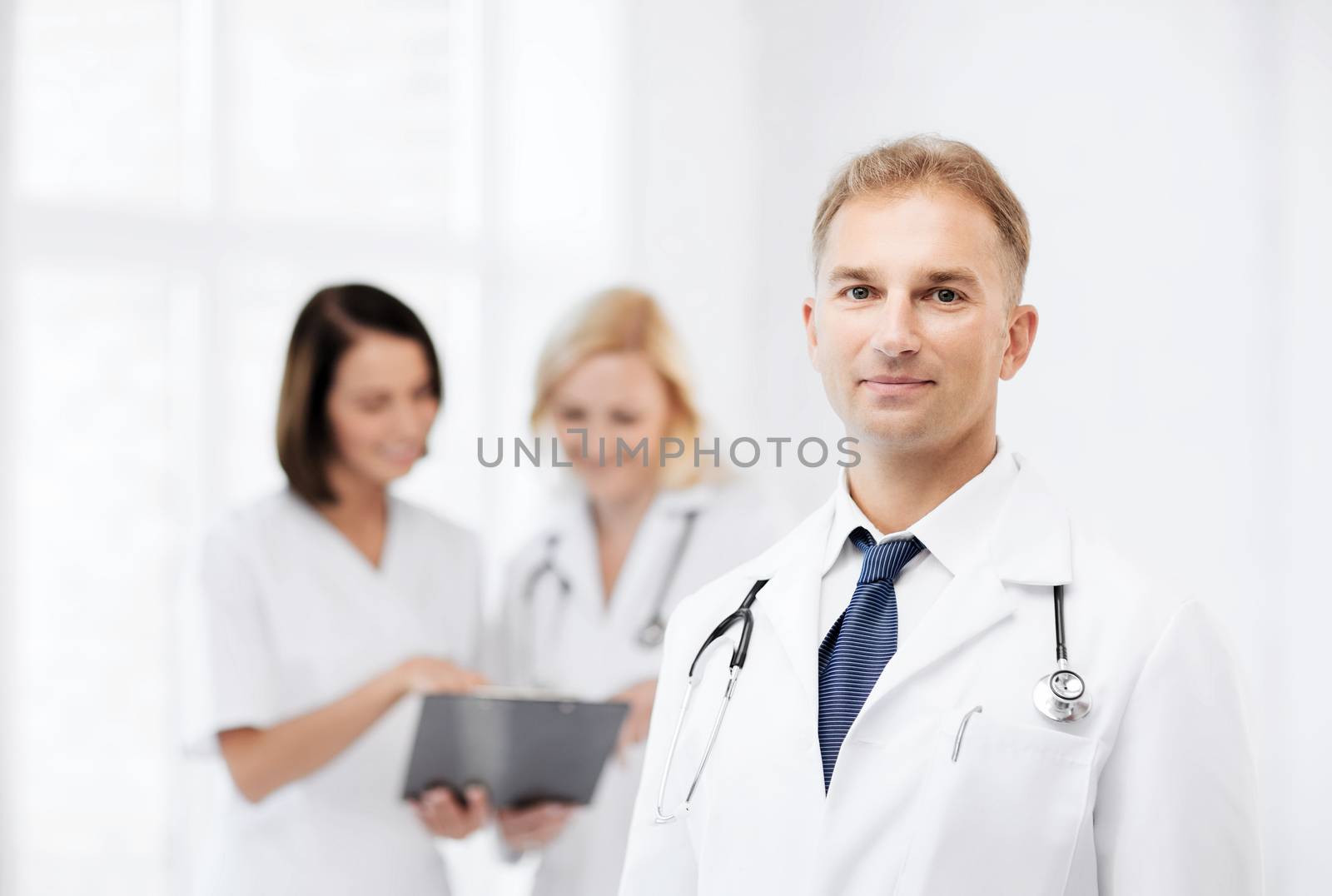 male doctor with colleagues by dolgachov