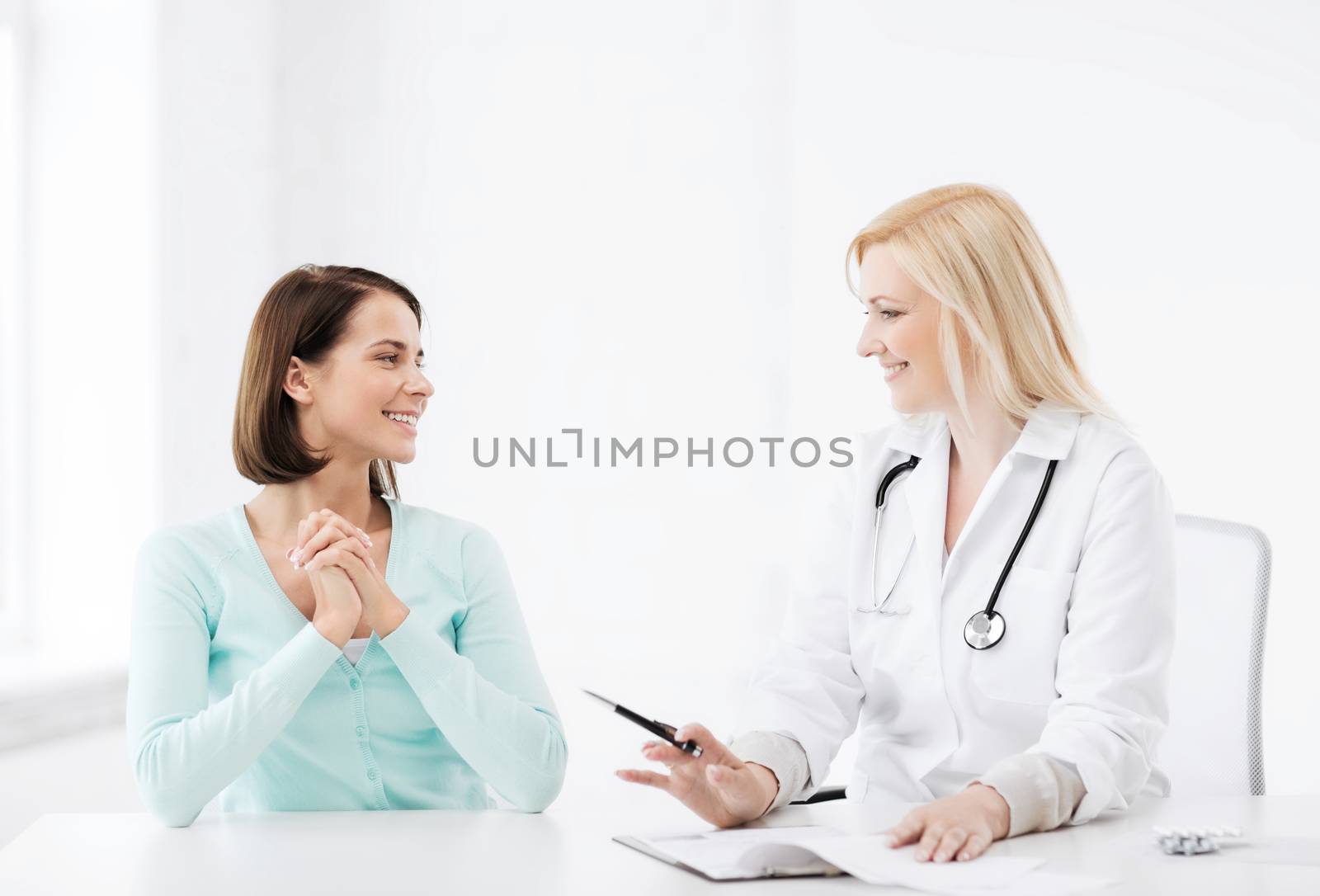 healthcare and medical concept - doctor with patient in hospital