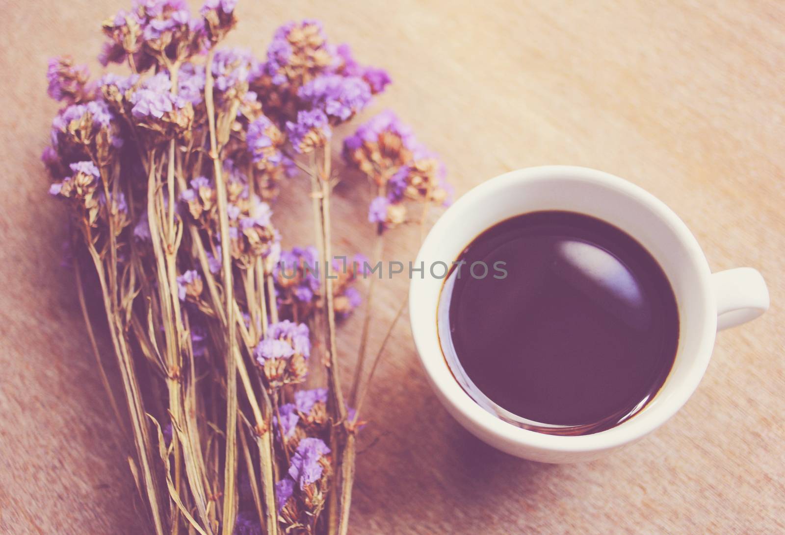 Hot coffee and statice flowers for decorated with retro filter e by nuchylee