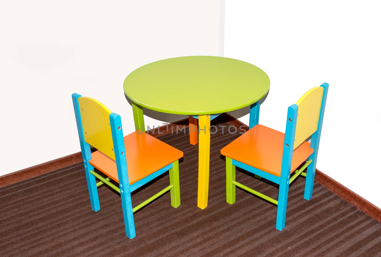 two small school chairs and table by compuinfoto