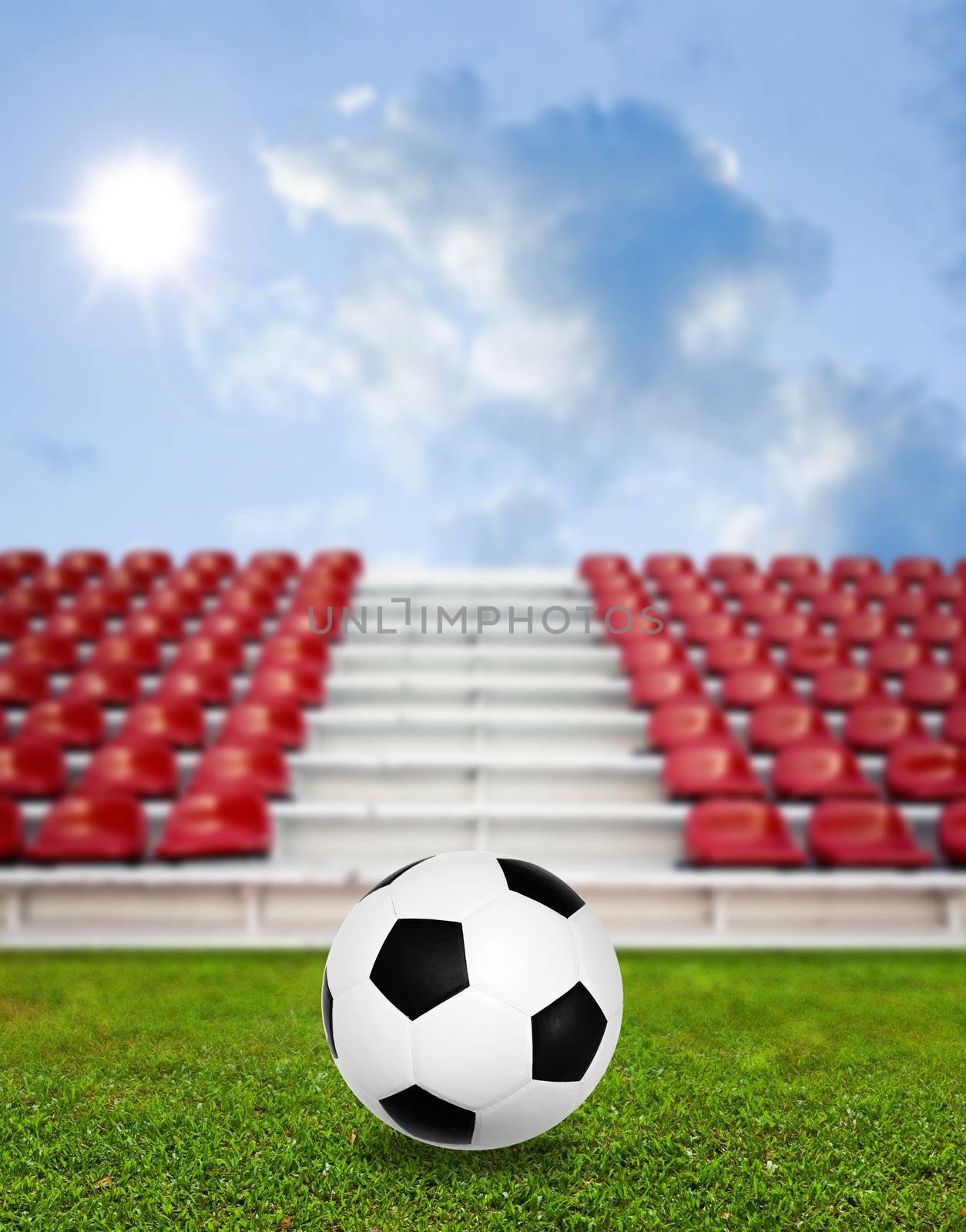 Soccer ball in sport arena with nice sky background