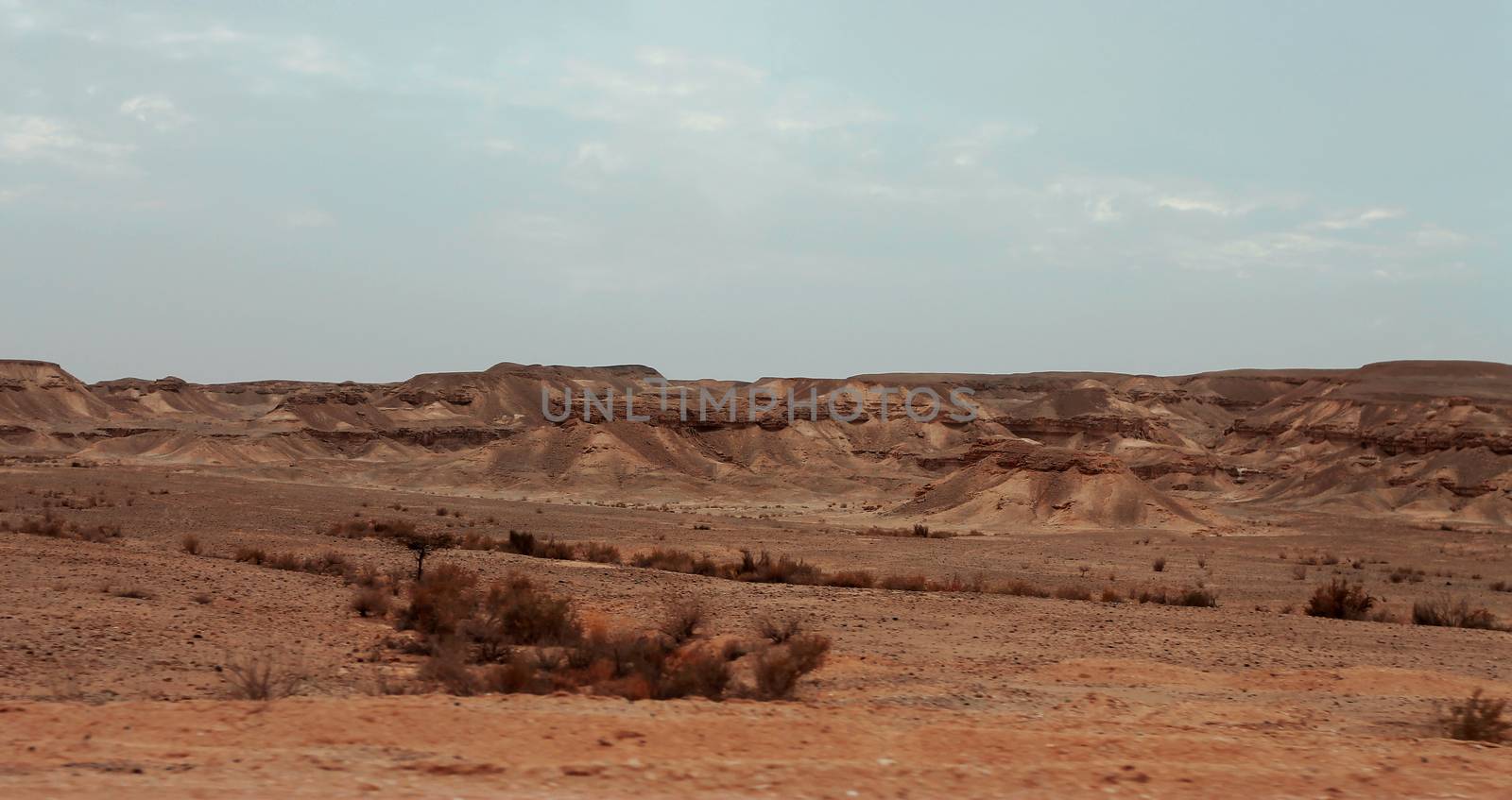 An Egyptian Desert And Mysty Sky in the daylight