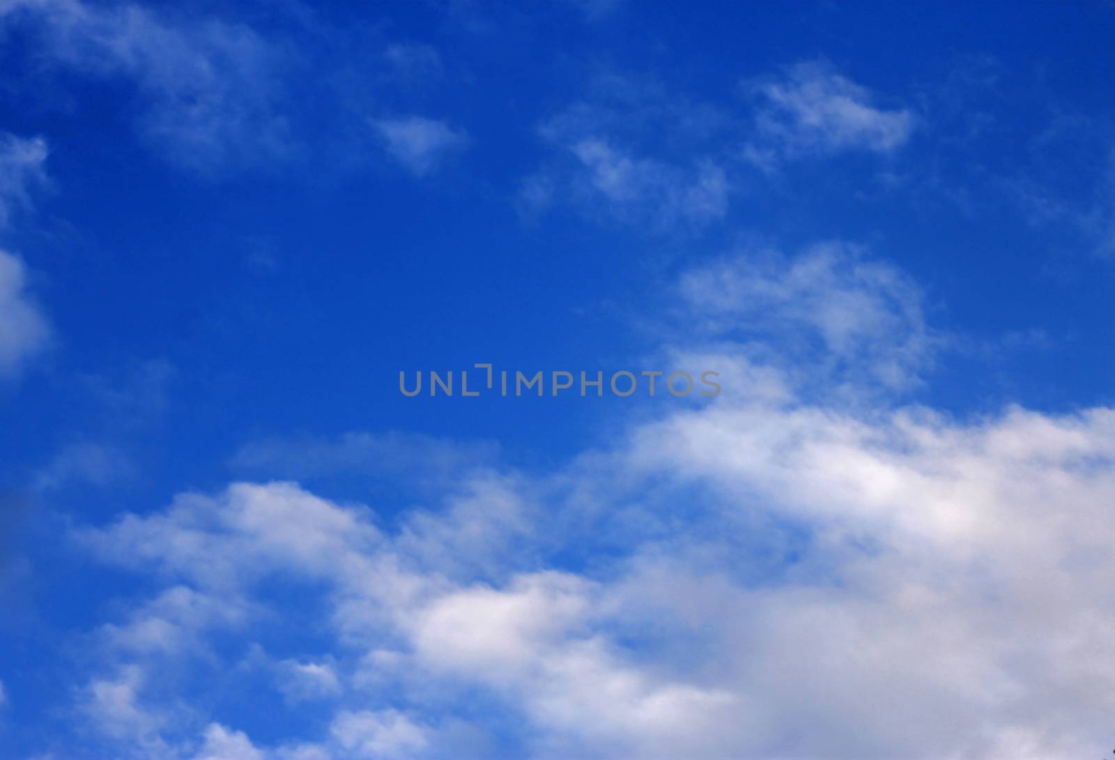 Blue sky and white clouds and the sun