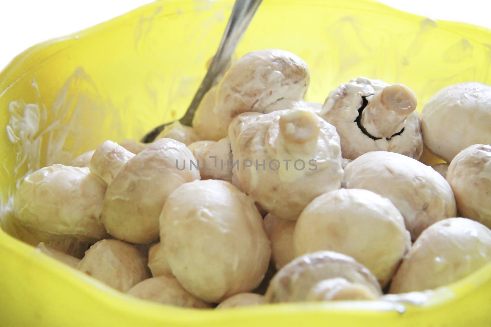 Champignon mushrooms in marinade ready for cooking