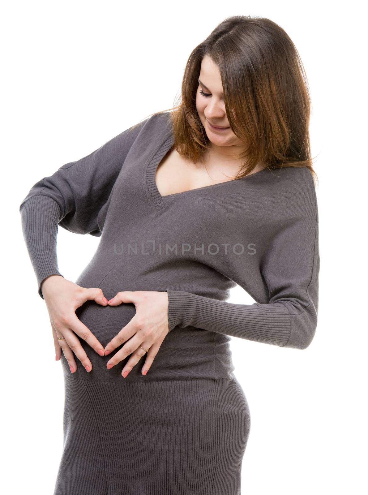 beautiful pregnant woman holding hands in heart shape isolated on a white background