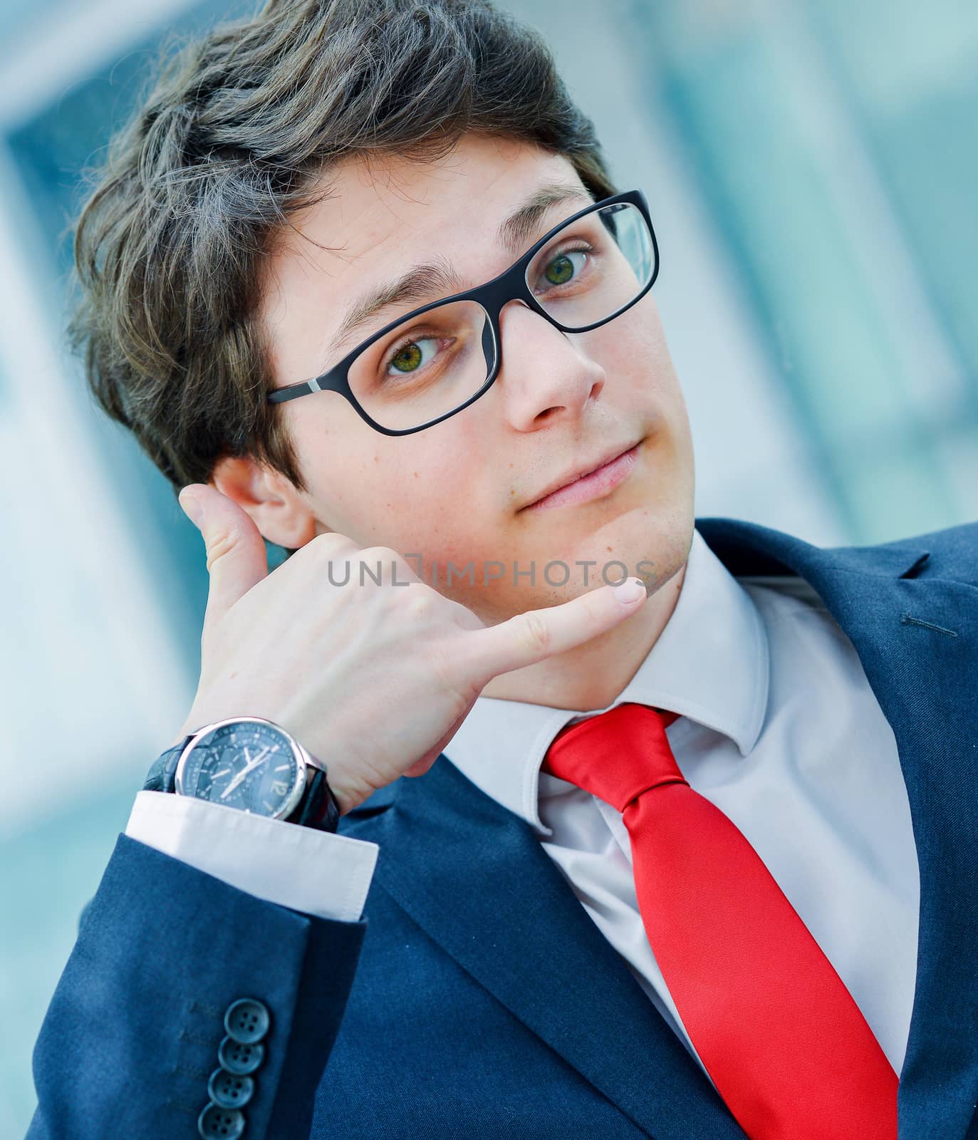 Dynamic junior executive gesturing to call
