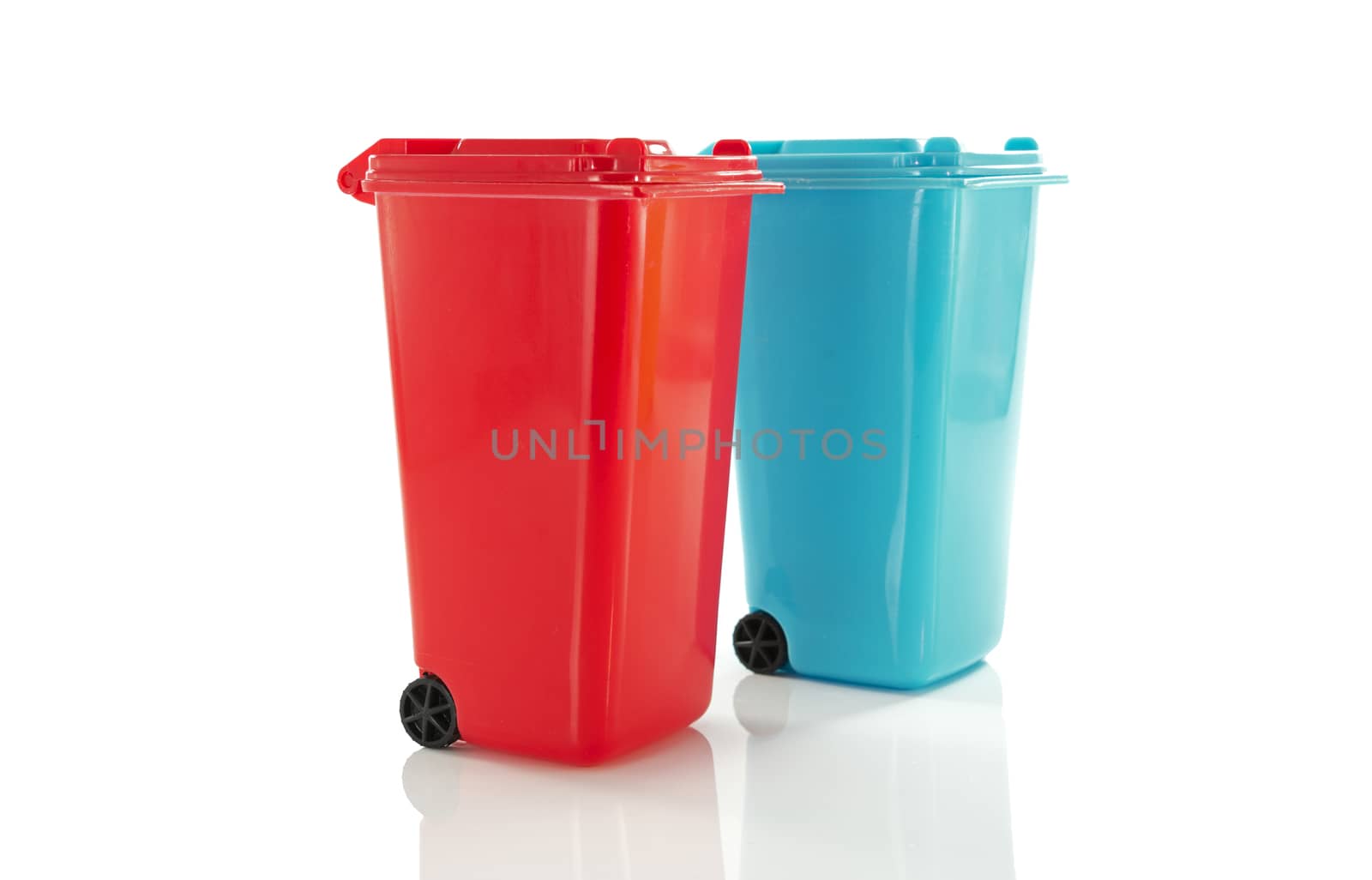red and blue  garbage bin by compuinfoto