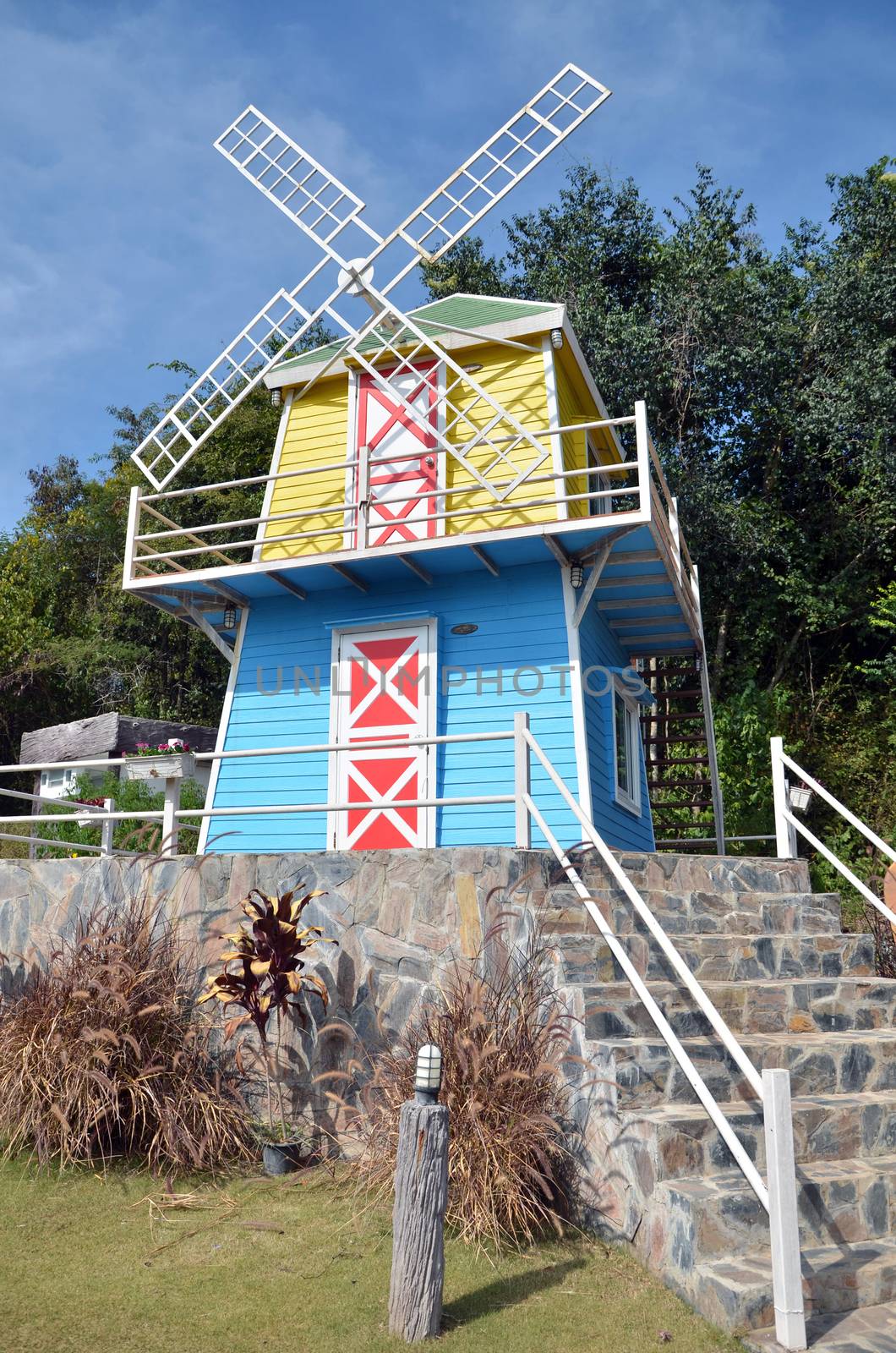 Wooden windmill house by siraanamwong