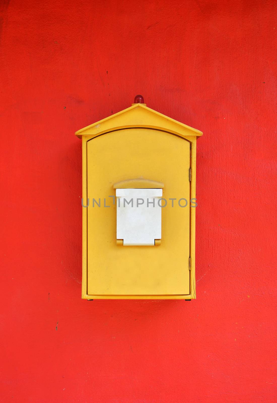 Yellow Decorated Mailbox on Red Background