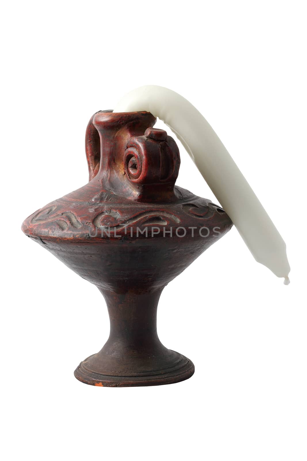 clay support with molten candle isolated over white background
