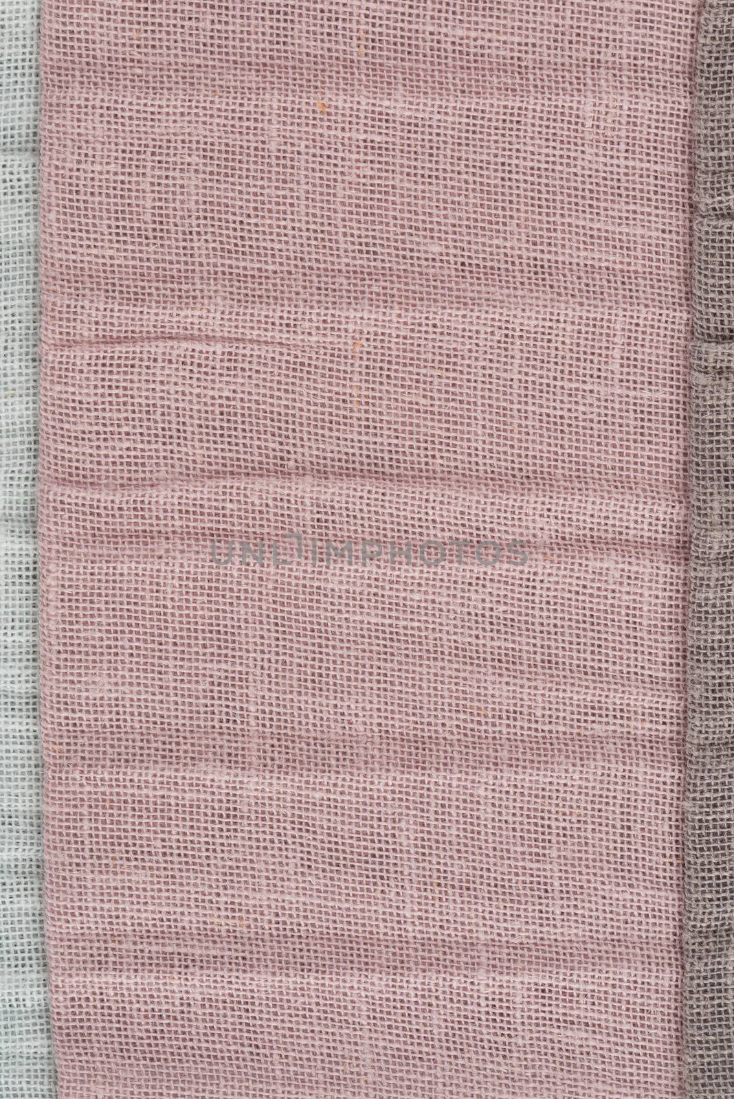 Closeup detail of pink fabric texture background