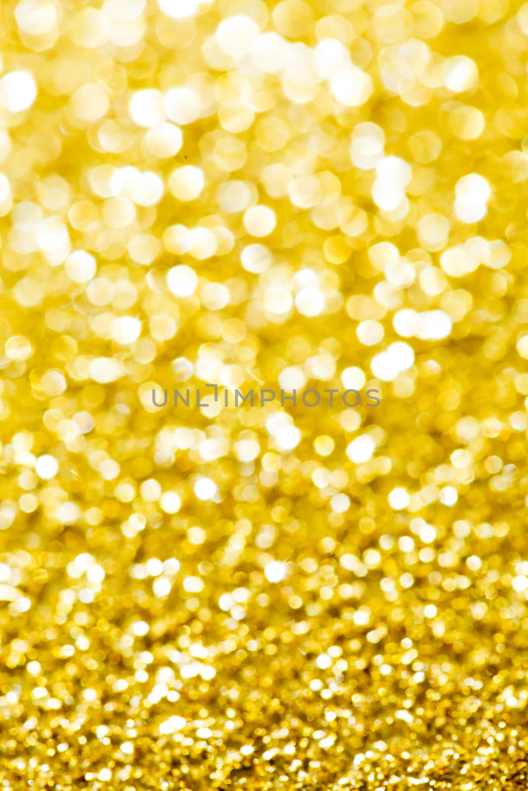 Abstract holidays golden lights on background