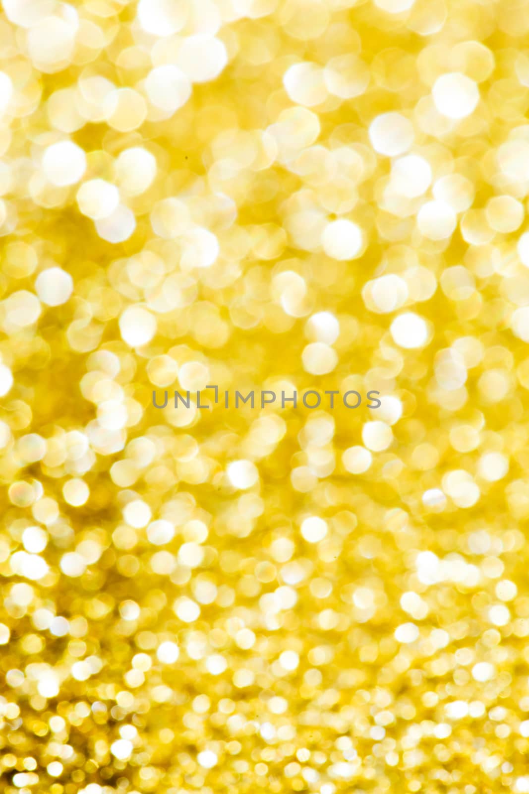 Abstract holidays golden lights on background