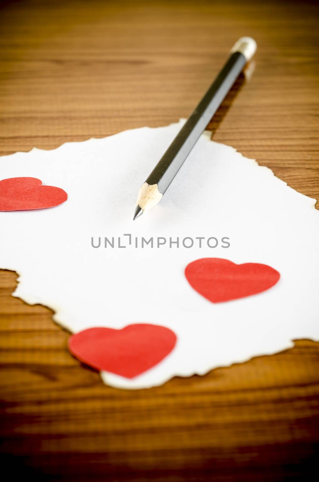 white paper with pencil and red heart by ammza12