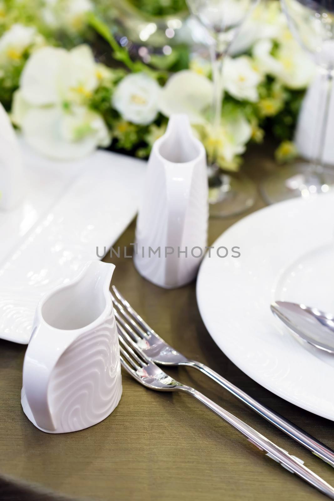 
Ceramic tableware on the table by shebeko