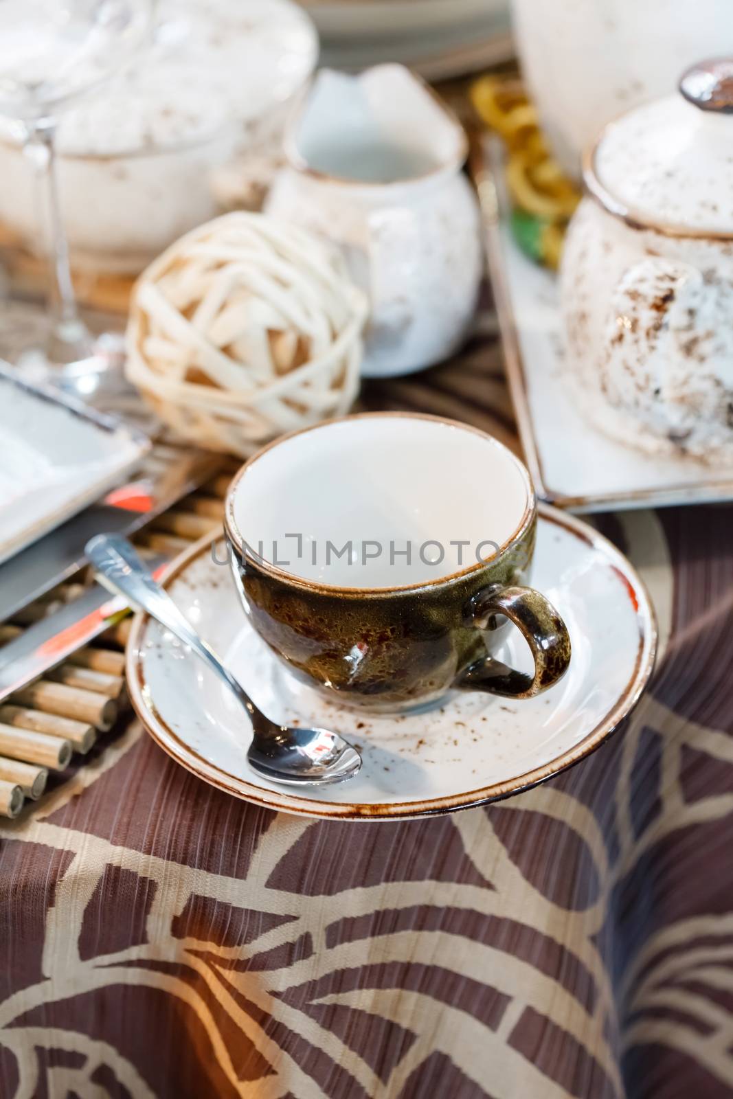 
Ceramic tableware on the table by shebeko