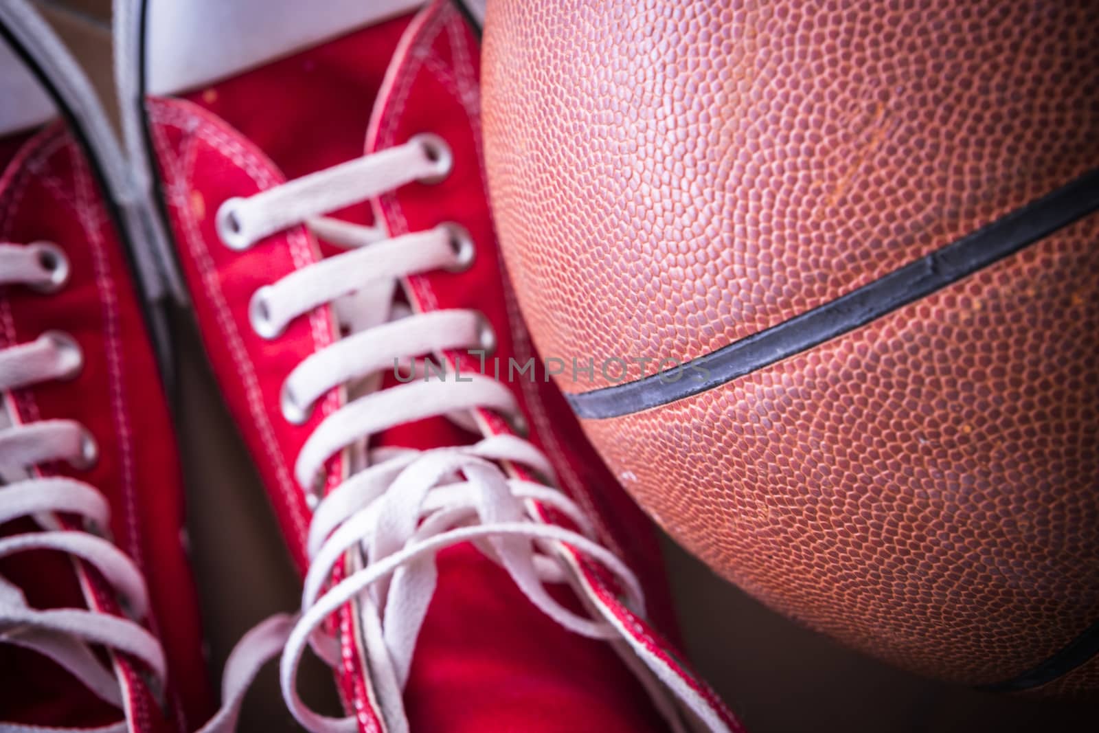 Sport sneakers and basket ball by digicomphoto