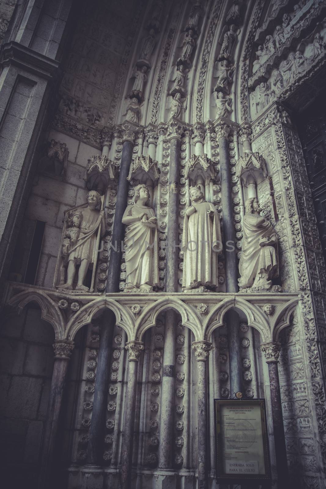 side entrance of the Cathedral of Toledo, arc with religious rel by FernandoCortes