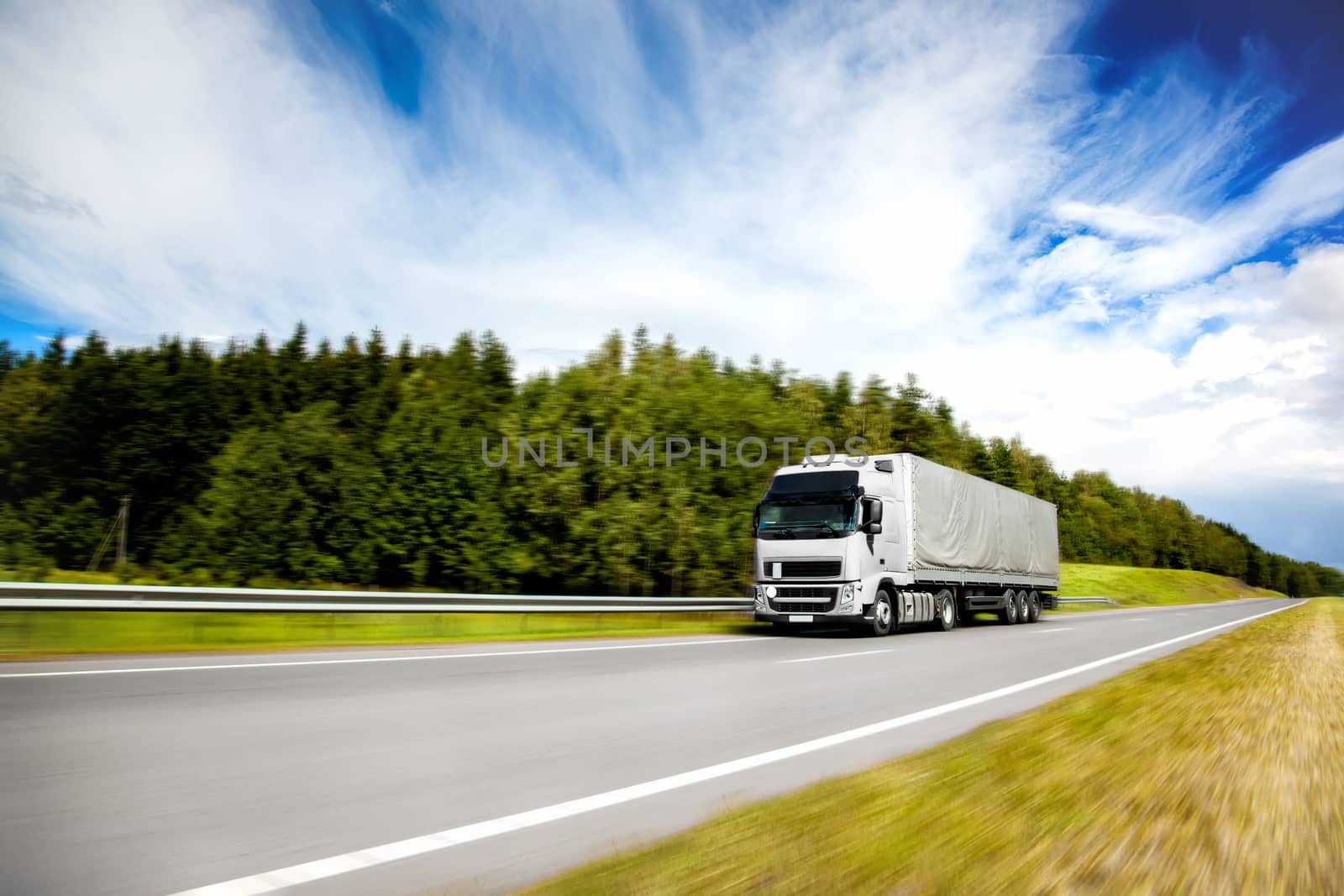 Truck delivery cargo on the highway in motion