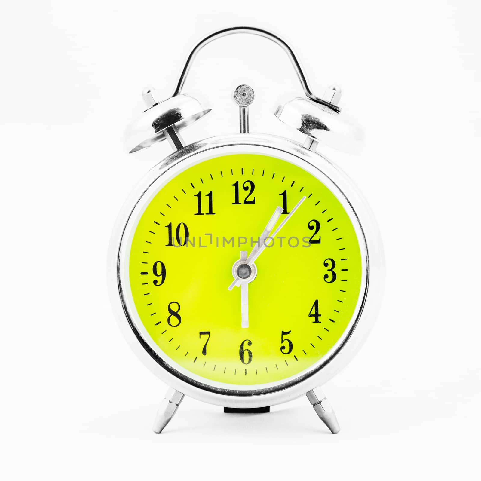 Alarm clock on white background. Showing time five minutes past six